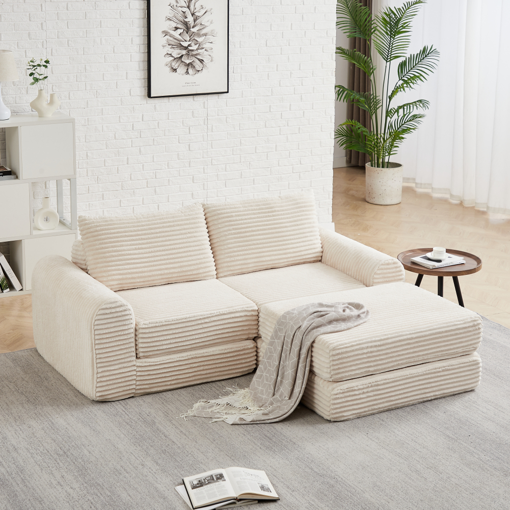 Sofá cama modular de pana beige con reposapiés extraíble y brazos curvos