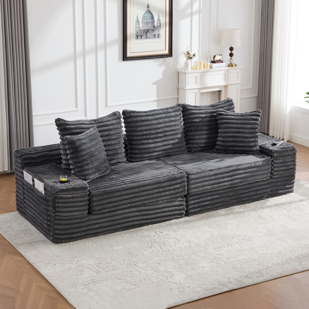 Sofá cama modular pana gris oscuro con respaldo alto y cojines