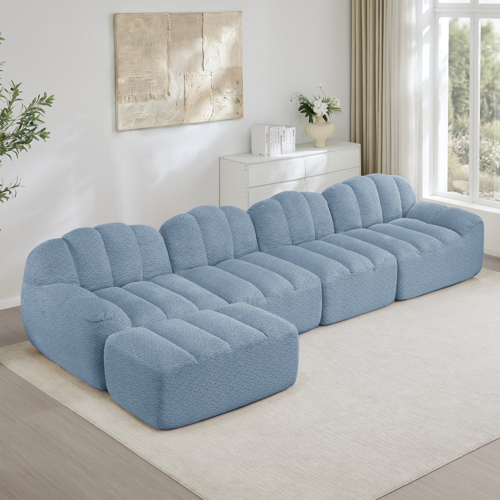 Sofá modular en l de 4 plazas con otomana en forro polar granulado azul