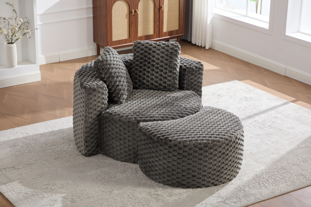 Sillón tela gris oscuro con reposapiés diseño redondo