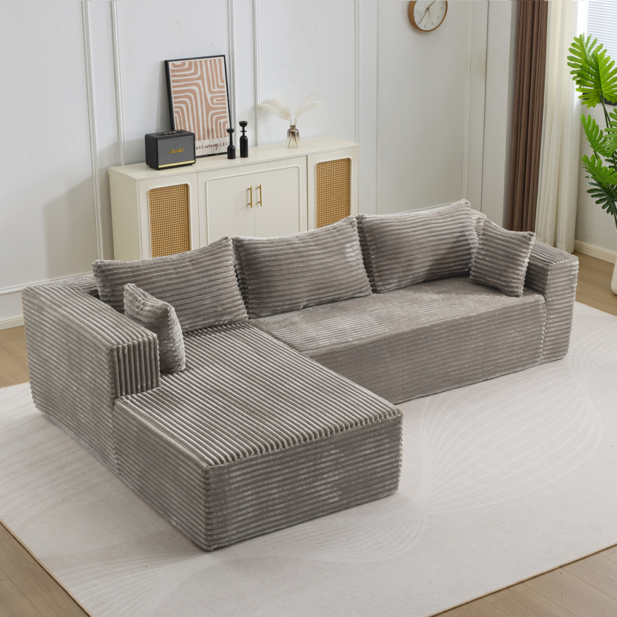 Sofá en l modular de pana gris con chaise longue asiento profundo