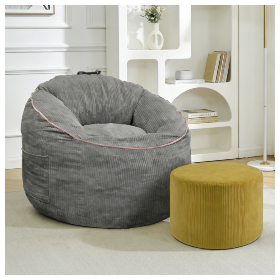 Sillón franela gris reposapiés bolsillo lateral rincón lectura