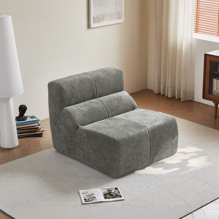 Sillón individual de tela gris claro acolchado y confortable