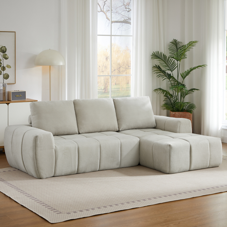 Sofá en l de pana beige con cojines desmontables diseño acolchado