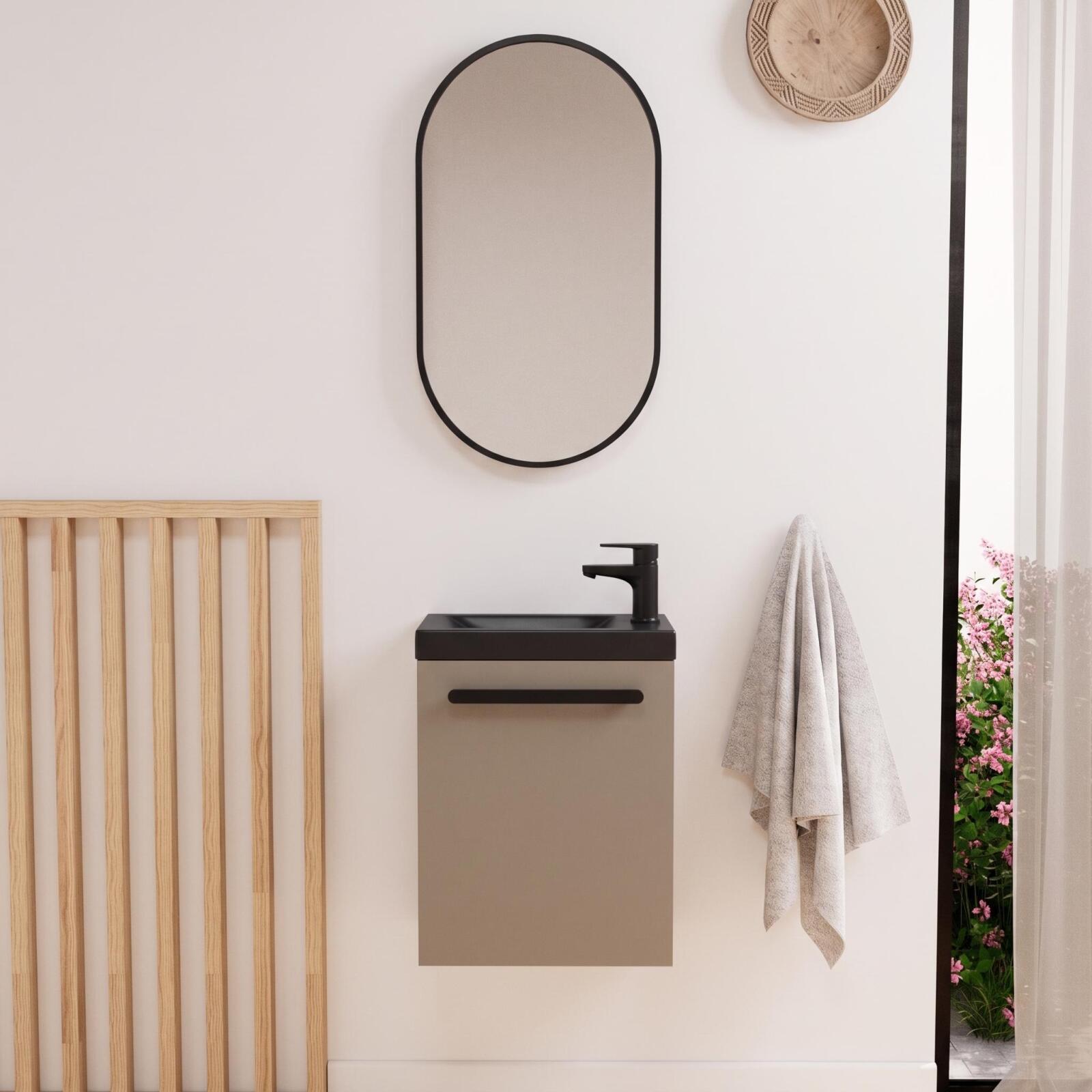 Conjunto de lavabo de pared nevada con grifería negra y espejo ovalado