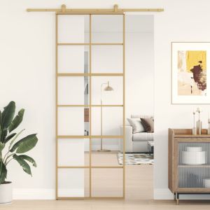 Puerta corredera dorada de vidrio esg transparente y aluminio esxt7899