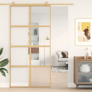 Puerta corredera dorada de vidrio esg transparente y aluminio esxt3239