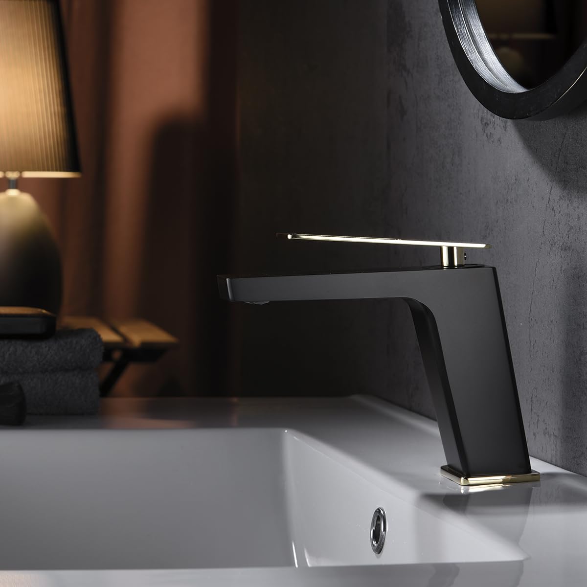 Imex - grifo monomando lavabo caño bajo negro oro serie suecia