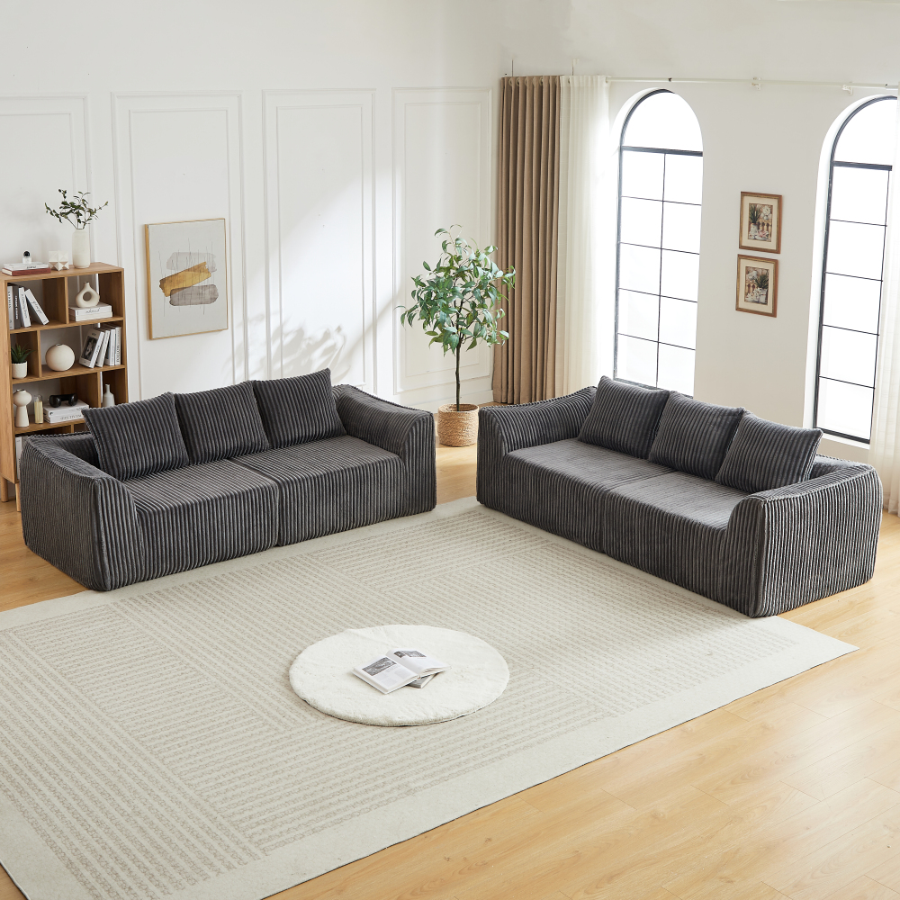 Sofá modular pana gris curvo con 5 cojines para salón
